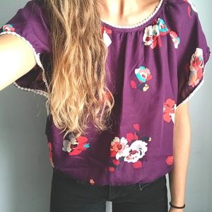 Plum floral blouse.
